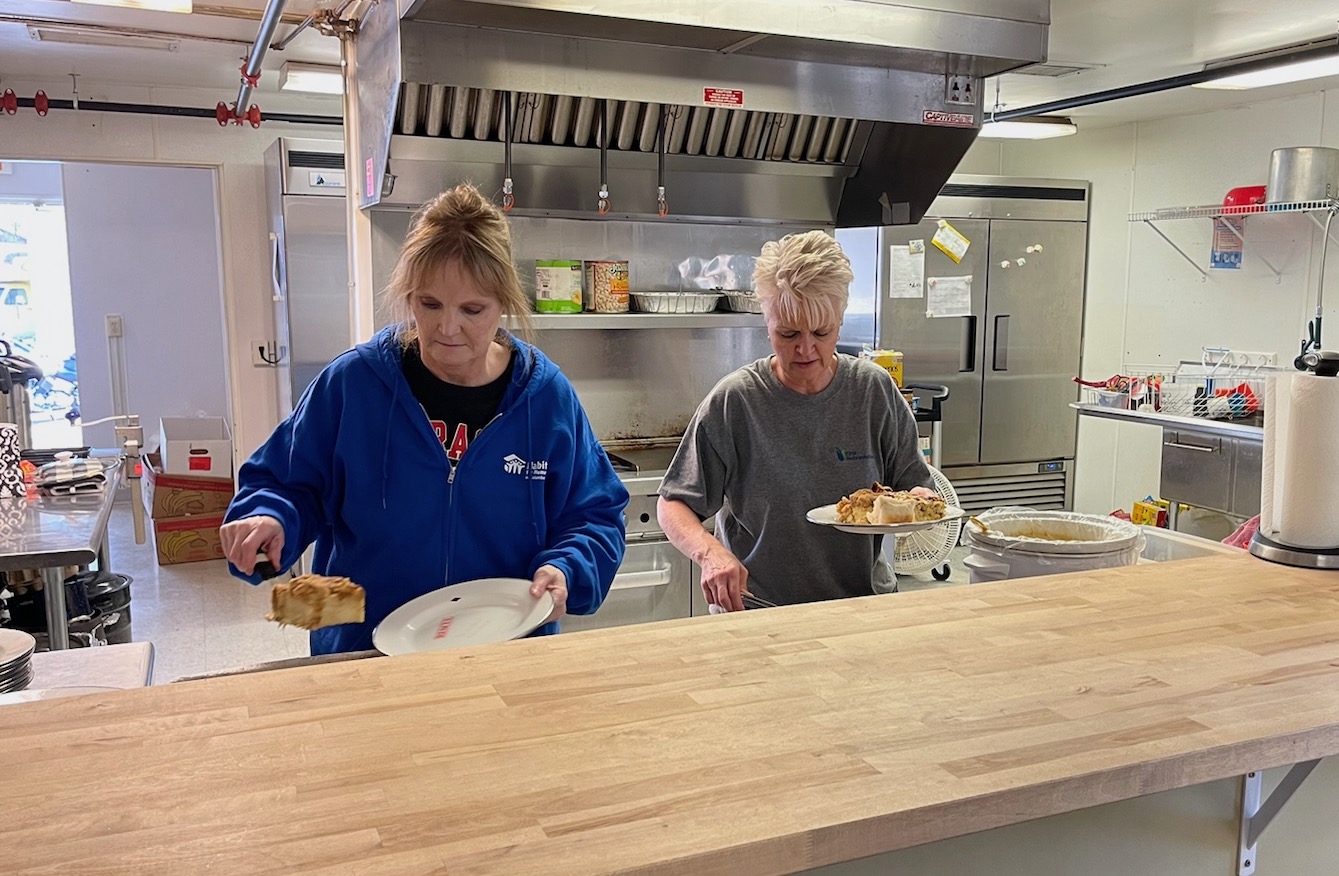 Angie and Tiffany cook meals monthly at the Columbus Rescue Mission.